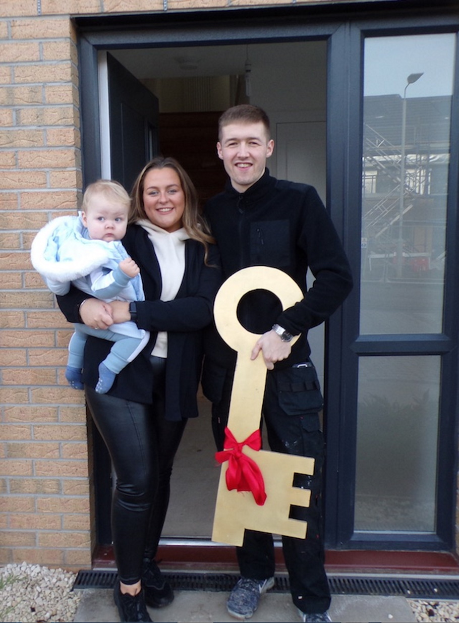 Sianice and Aiden with Blake outside their new home