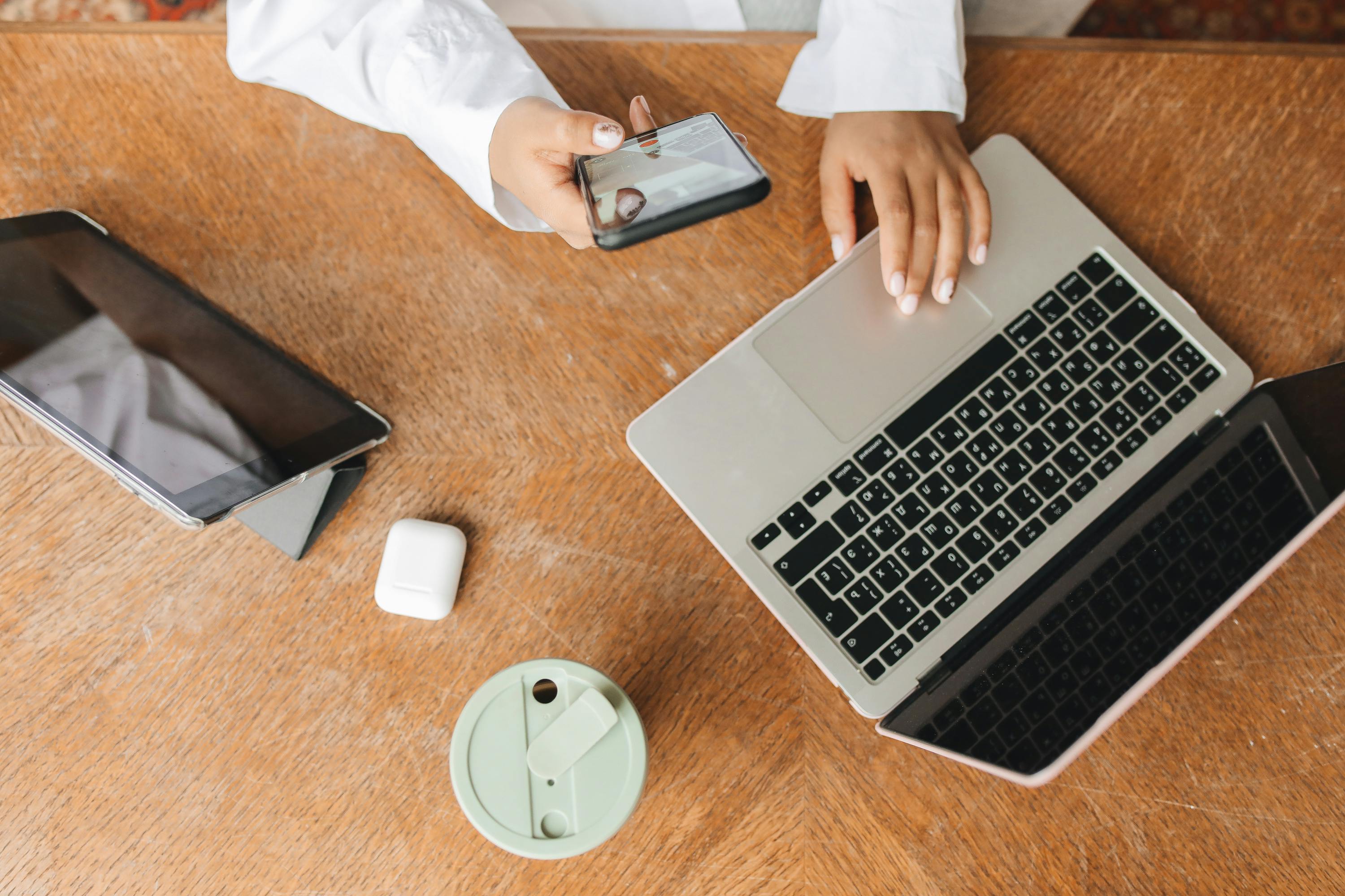 image of person using laptop phone and tablet